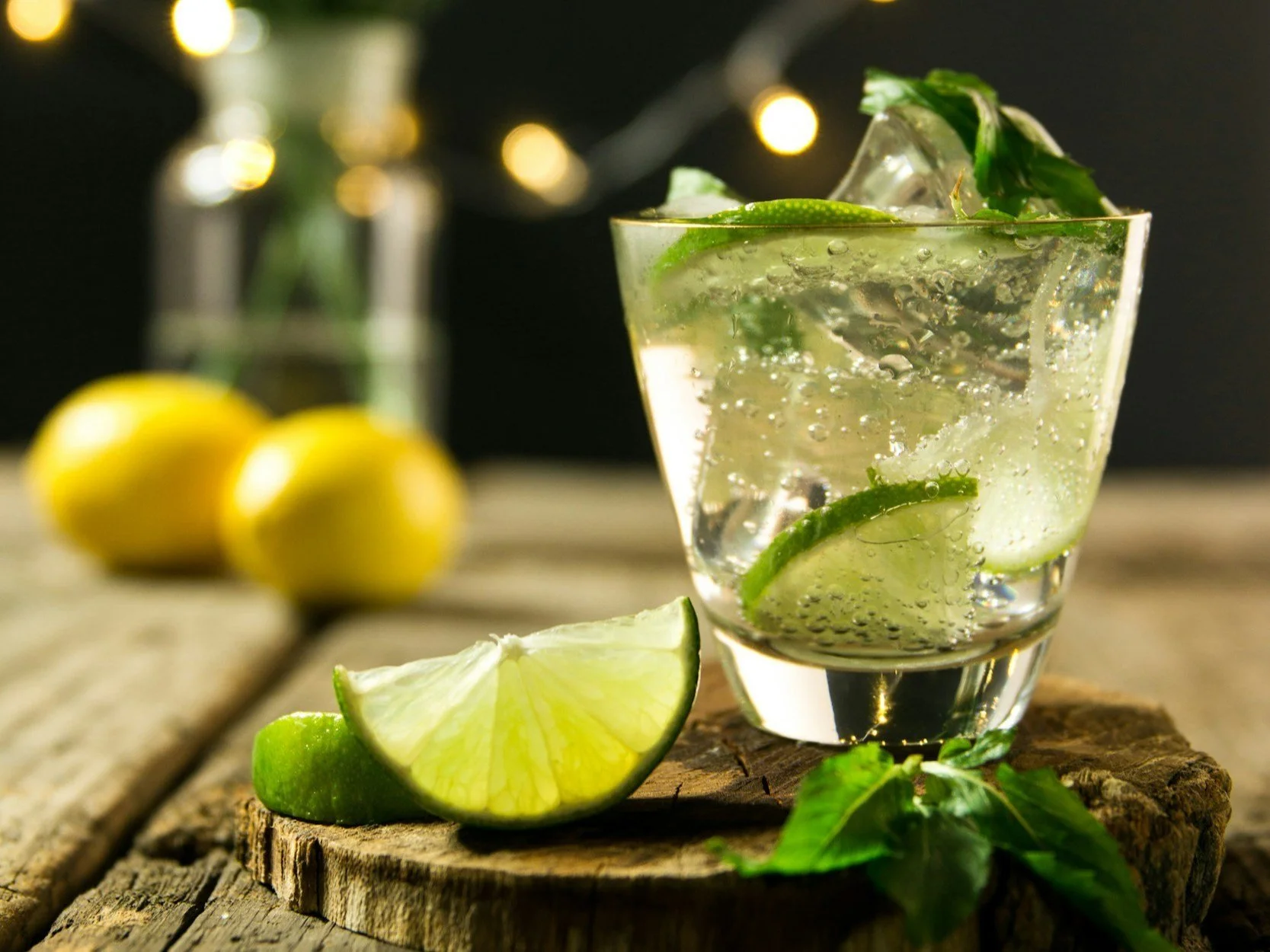 Fresh mojito cocktail with lime and mint garnish.