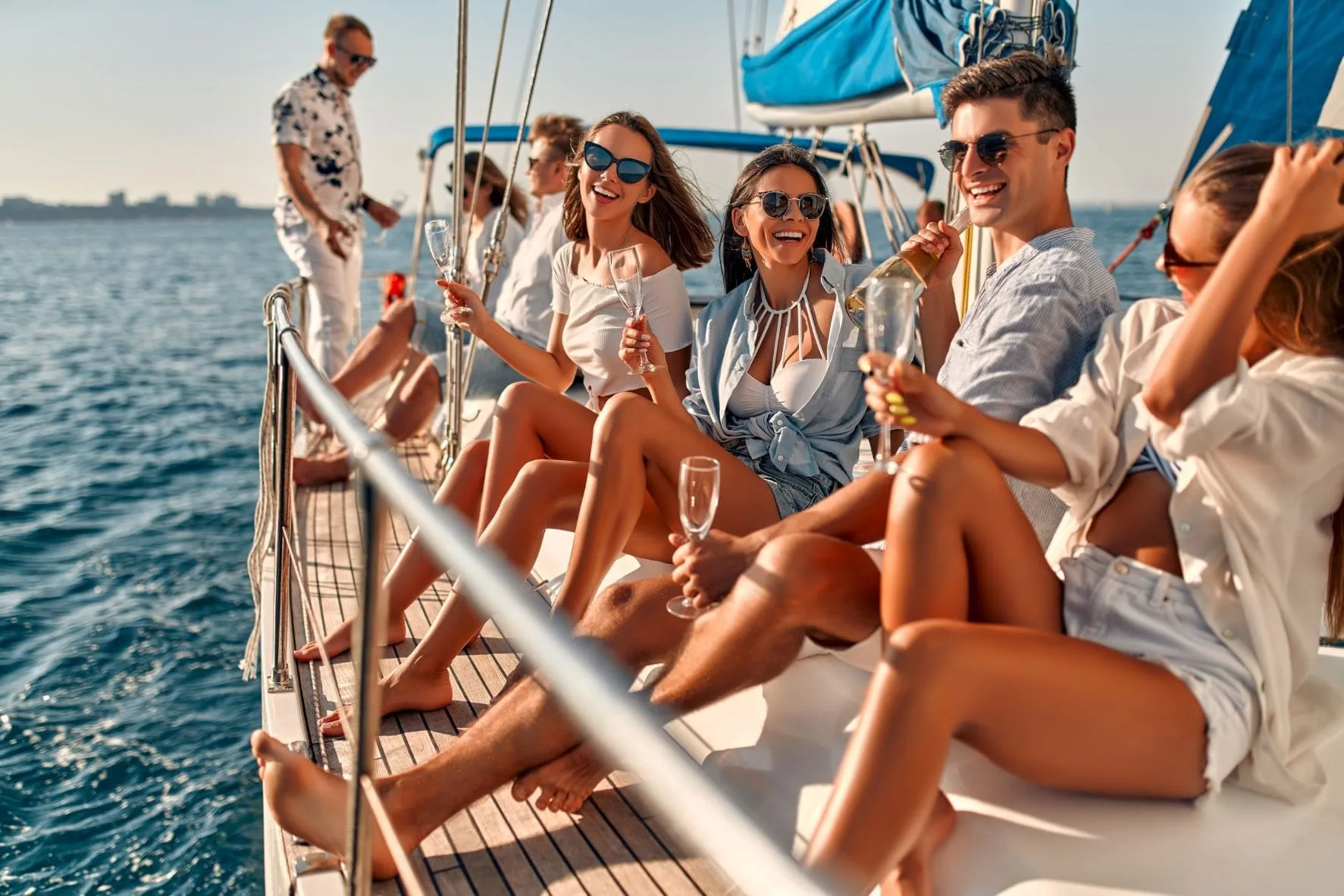 Friends enjoying drinks on a private yacht in Ibiza