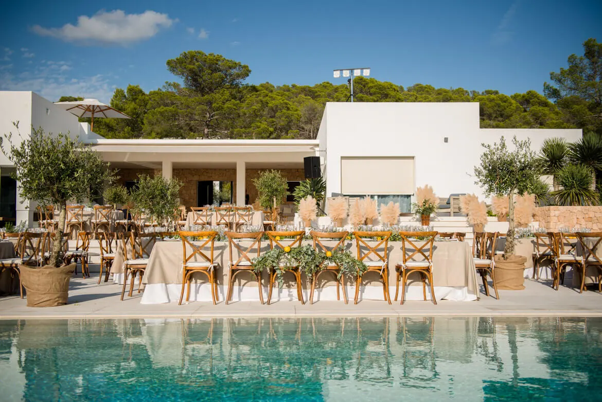 Poolside villa event setup with outdoor dining in Ibiza