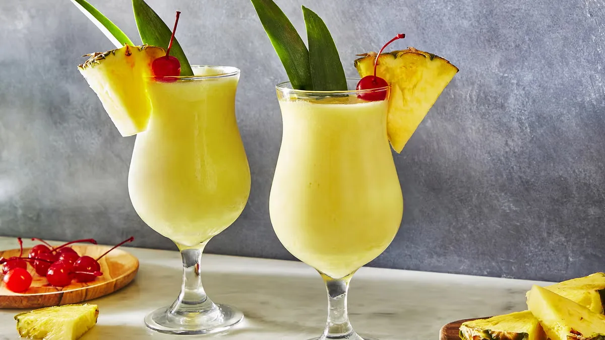 2 glasses of pina colada on a surface