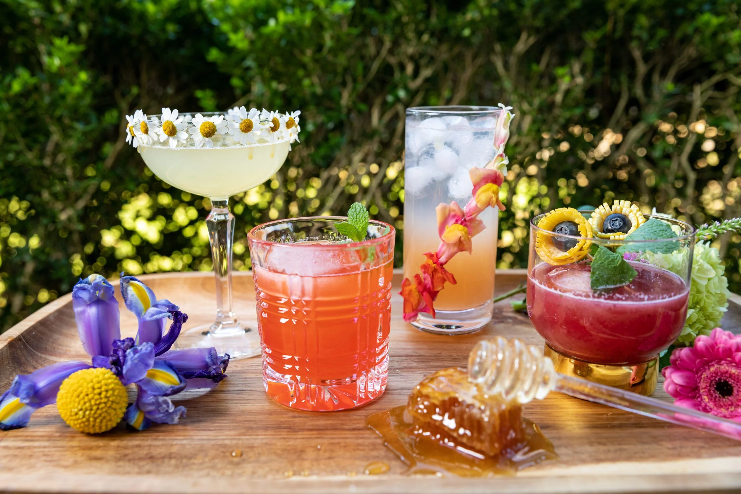 Colorful floral cocktails and refreshing drinks served outdoors.