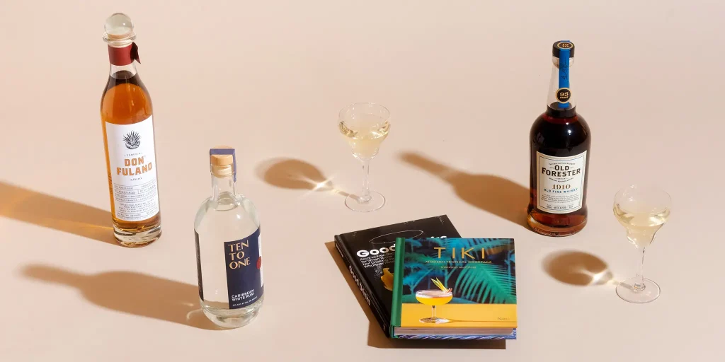 Premium drink bottles with cocktail books and glasses for gift inspiration.