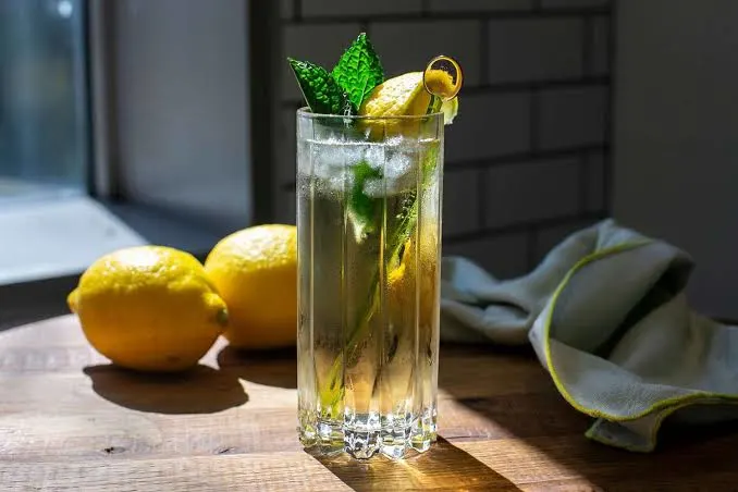rebujito in a tall glass on a wooden table. (1)