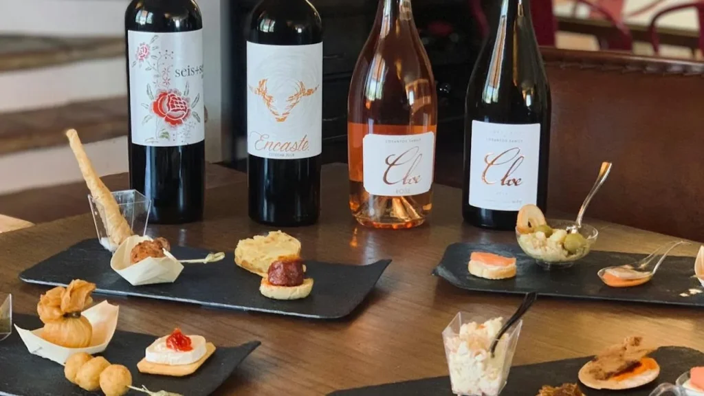Spanish wine bottles served with gourmet tapas.